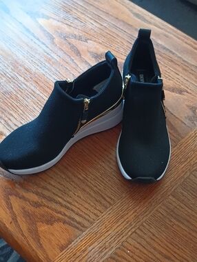 DKNY Black Slip-On Wedge Sneakers with White Sole and Gold Accents